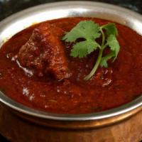 Lamb Tikka Masala · Dairy. Marinated lamb cooked in a clay oven and simmered in our house special tikka sauce.