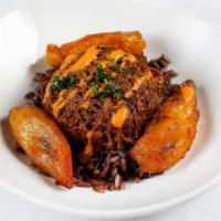 Ropa Vieja · braised/shredded skirt steak stewed with peppers, tomatoes and chilis, spiced yellow rice, s...