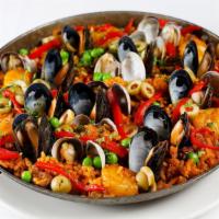 Paella · our cuban-inspired preparation includes shrimp, mussels, chicken, and chorizo, cooked fresh ...