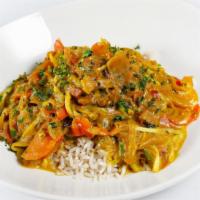 Caribbean Curry · mild turmeric based curry, spinach, yuca, sweet red peppers, coconut milk, chili peppers, ve...