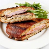 Cubano Sandwich · house roasted pork shoulder, ham, swiss cheese, dijon mustard, dill pickle...  on butter gri...