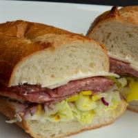 Salami Sandwich · Served with mayonnaise, mustard, lettuce, tomatoes, onions, pickles, peppers, and jalapenos.