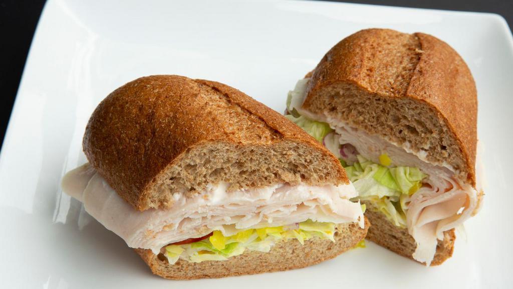Hot Turkey Sandwich · Served with mayonnaise, mustard, lettuce, tomatoes, onions, pickles, peppers, and jalapenos.