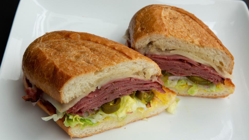 Hot Pastrami Sandwich · Served with mayonnaise, mustard, lettuce, tomatoes, onions, pickles, peppers, and jalapenos.