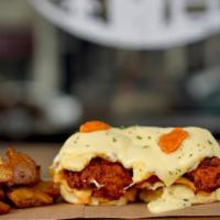 Fried Chicken Benedict · two biscuits topped with garlic aioli spread, crispy fried chicken, fried egg and topped wit...