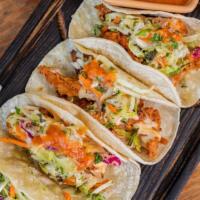 Fried Chicken Tacos Memphis Style · Three crispy tacos on flour tortillas with lemon cabbage slaw, Memphis sauce (spicy) garnish...