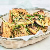 Garlic Bread - a Chef Manzo favorite · House-made bread, garlic butter, paprika and fresh basil. Vegetarian.