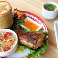 Grilled Chicken Combo · Grilled chicken thigh, papaya salad, and sticky rice, served with fresh mixed greens and swe...