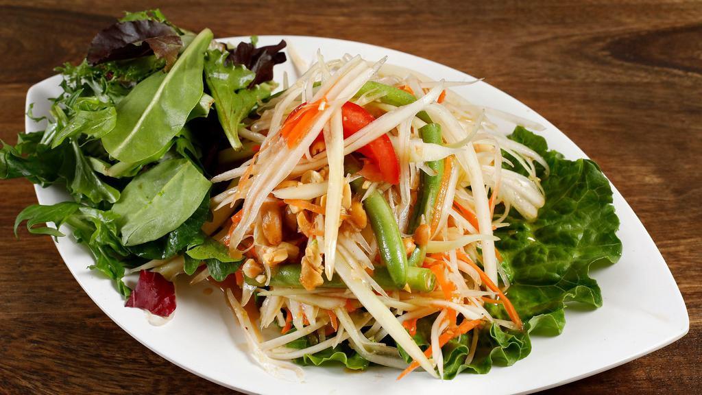 Papaya Salad · Shredded papaya, tomato, carrots, and peanuts tossed with sweet tamarind dressing., served with fresh mixed greens. Add grilled Tiger Prawns for an additional charge.