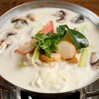 Tom Kha · Coconut milk soup, galangal, lemon grass, lime leaves, cabbage, mushroom, tomato, cilantro