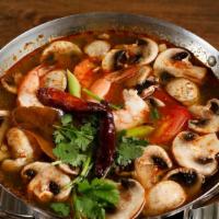 Tom Yum · Hot and sour soup, galangal, lemon grass, lime leaves, mushroom, tomato, cilantro