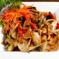 Pad Kee Mow · In wok - Flat noodle, bell pepper, onion, baby corn, bean sprout and basil with soy sauce.