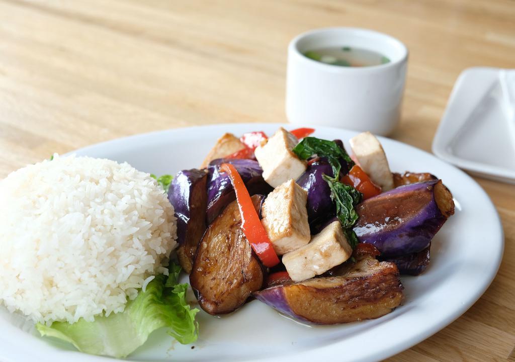 Eggplant (served with jasmine rice) · In a wok - Eggplant, bell pepper and basil with basil sauce.