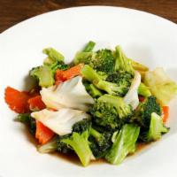 Pad Pak (served with jasmine rice) · Stir fried assorted vegetables with garlic sauce.