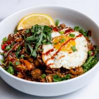 Chicken and Egg · Marinated chicken with charred peppers, cucumber slaw, caramelized onions, a fried egg, fres...