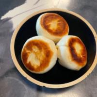 Black Pepper Beef Bun · Minced beef in a sweet and peppery sauce steamed then pan-seared with a golden crust.