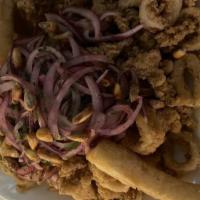 Chicharron de Calamar · Lightly breaded deep fried calamari, baby octopus, fried yucas, canchita (toasted corn) and ...