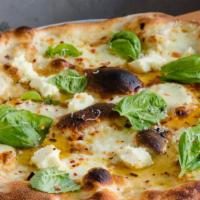 Bianca · classic white and green pie of Italy. 
mozzarella, ricotta, fresh basil, extra virgin olive ...