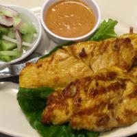 Chicken Satay · Chicken breast marinated in curry and coconut milk on skewers; served with peanut sauce and ...