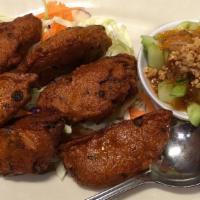 Fish Cake · Deep fried seasoned fish cake; served with cucumber and ground peanut in spicy sweet and sou...