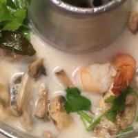 Tom Kha · Traditional coconut milk soup simmered with lemongrass, kaffir lime leaves, galangal, and mu...