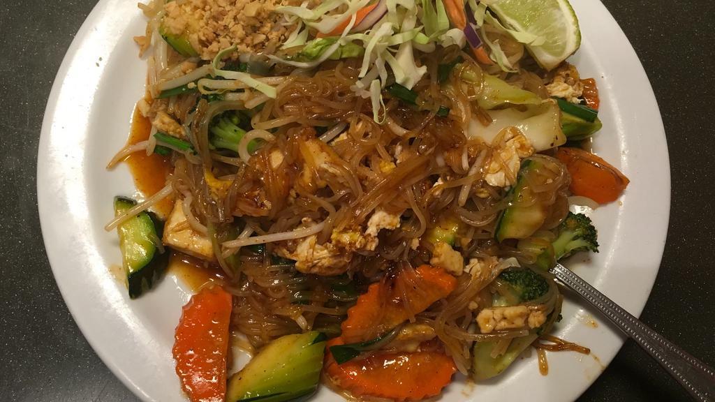 Pad Thai · Thai rice noodles sautéed with your choice of meat, eggs, tofu, and bean sprout, chive topped with roasted ground peanuts.