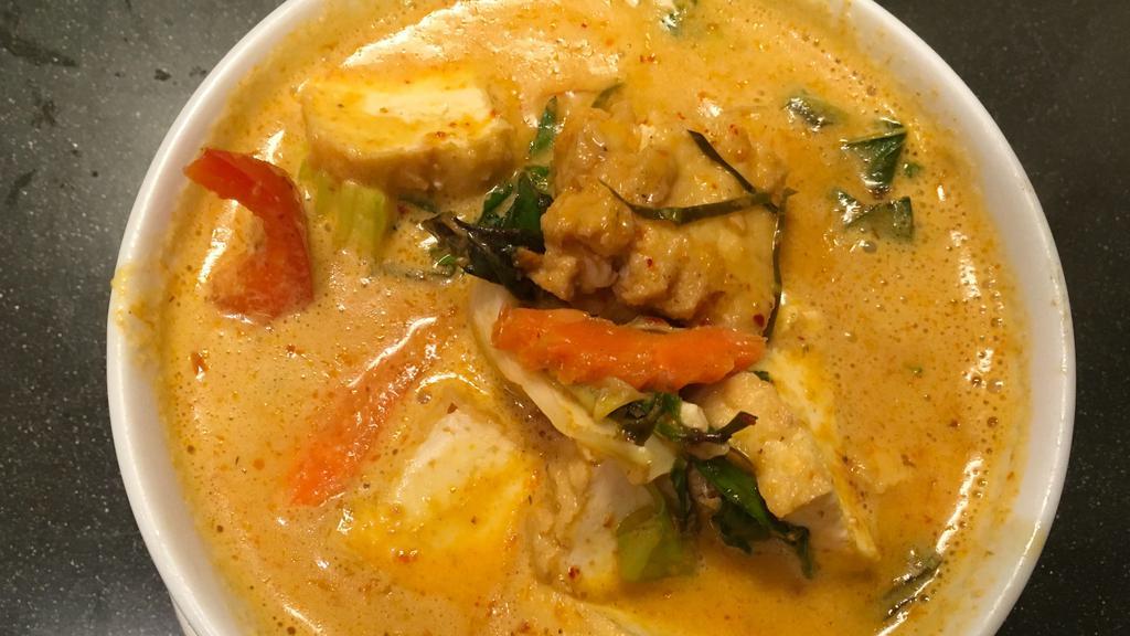 Panang Curry · Medium Spicy. Choice of meat cooked with bell pepper, zucchini, carrot, and Thai basil in panang curry and coconut milk.