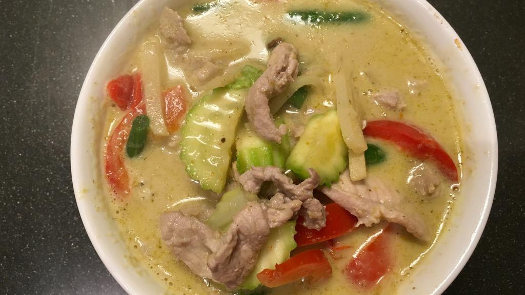 Green Curry · Spicy   Choice of meat cooked with bell pepper, shredded bamboo, green bean, zucchini, and Thai basil in green curry and coconut milk.