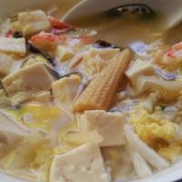 Seafood Noodle Soup · Hu tieu do bien. Scallop, calaman, prawn, imitation crab, fish cake over clear noodle, egg n...