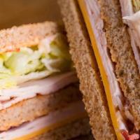 Spicy Geary Club · turkey, bacon, cheddar cheese, lettuce, tomato and spicy chipotle mayo on whole wheat bread