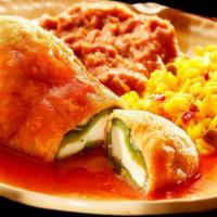 18. Chiles Rellenos · Roasted poblano peppers stuffed with cheese, dipped in a fluffy egg batter, and fried until ...