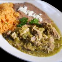 22. Chile Verde · Tender pork with tomatillo and roasted pepper sauce served with rice and beans.