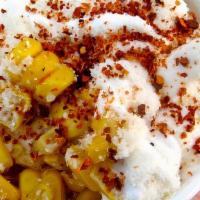 Corn in a Cup · Fresh cooked corn, filled with mayonnaise, cotija, chili powder.