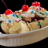 Banana Split · Ice cream served on a banana sliced in half lengthwise and garnished with flavored syrups, w...