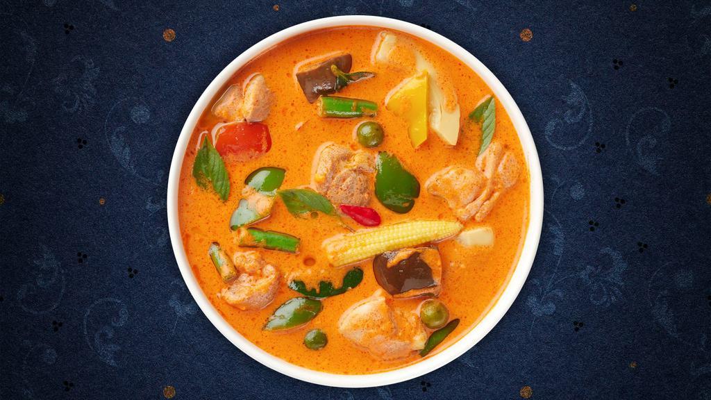 Blazing Panang Curry Bowl · Red curry paste with coconut milk, bell peppers, onions, basil and your choice of protein on white rice, served with your choice of sauce.