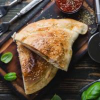 The Chicken Pesto Calzone · Delicious and freshly cooked calzone with mozzarella, ricotta, pepperoni, roasted chicken an...