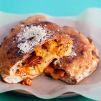 The Chicken Bacon Calzone · Delicious and freshly cooked calzone with mozzarella, ricotta, roasted chicken, and bacon.
