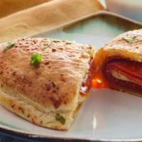 Pepperoni Calzone · Delicious calzone fresh out of the oven, filled with pepperoni & ricotta and mozzarella chee...