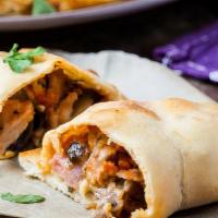 The BBQ Chicken Calzone · Delicious and freshly cooked calzone with mozzarella, ricotta, BBQ chicken, and red onions.