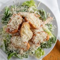 Caesar Salad · Romaine lettuce tossed with our house Caesar dressing, fresh parmesan cheese and topped with...