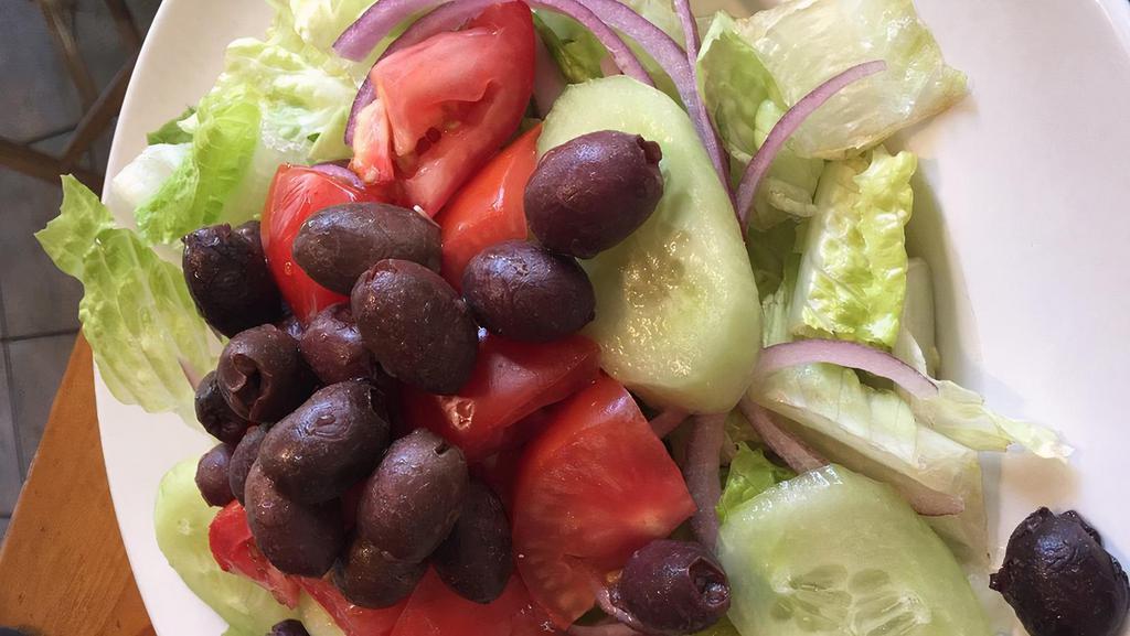 Greek Salad · Fresh lettuce with red onions, tomatoes, cucumbers, calamata olives and feta cheese with vinaigrette dressing.