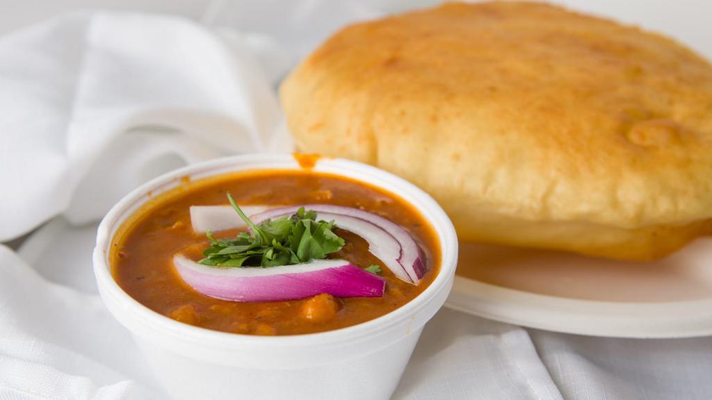 Chole Batura · Huge fried fluffy bread served with garbonzo beans curry.