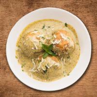 Creamy Veggie Dumpling Curry · Indian vegetarian balls (kofta) made of potato and paneer are deep fried and served in a cre...