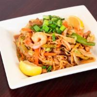 Pancit Canton (Egg Noodle) · Seafood, a popular dish. Sautéed with vegetables, pork, chicken, and shrimp.