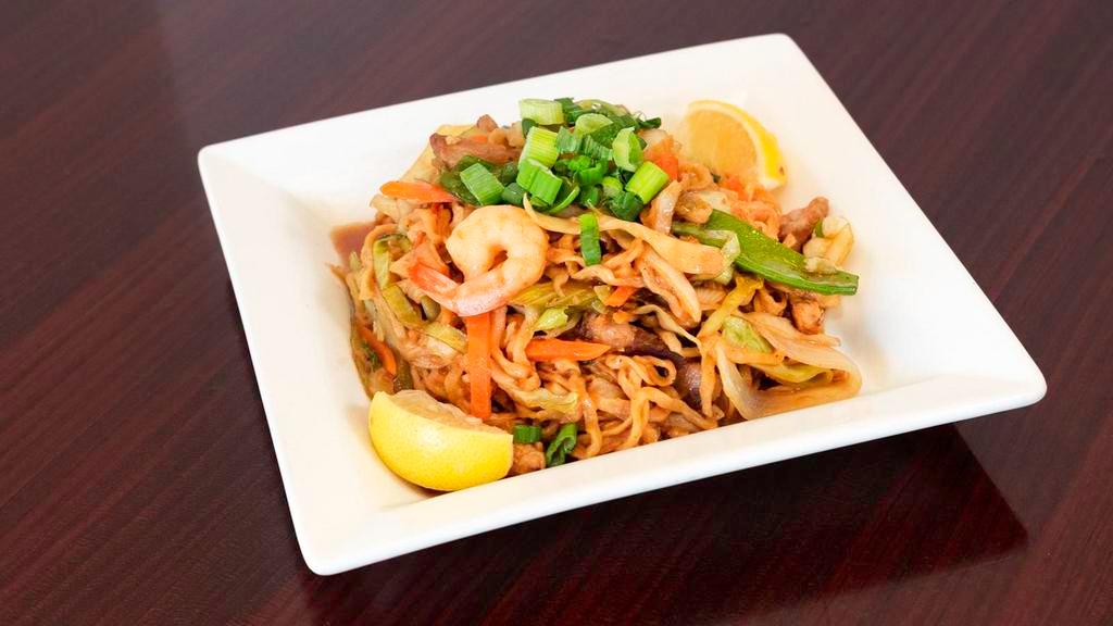 Pancit Canton (Egg Noodle) · Sautéed with vegetables, pork, chicken, and shrimp. A popular dish.