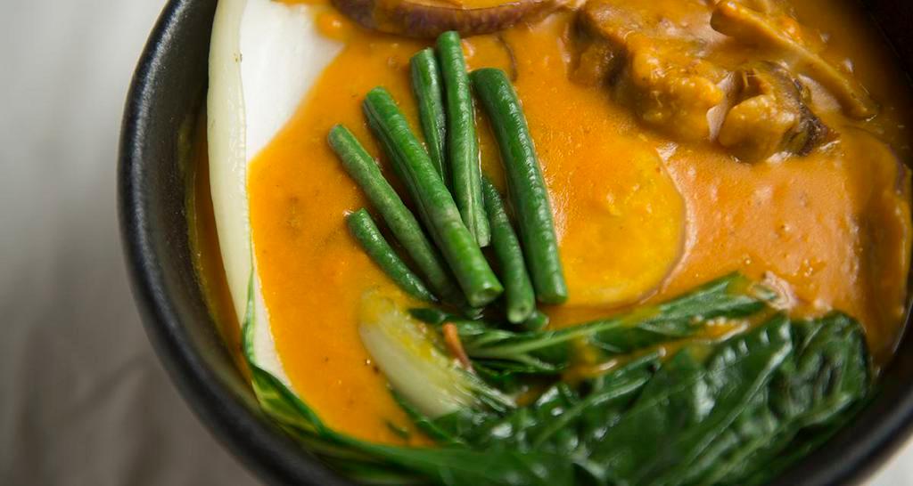 Kare-Kare (Beef Peanut Stew) · Contain nuts, seafood, house specialty. Beef shank and oxtail with vegetables simmered in thick peanut sauce, served with shrimp paste on the side. A native delicacy.
