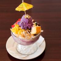 Halo Halo · A blend of refreshing tropical fruit preserves, beans and milk in shaved ice. Topped with a ...