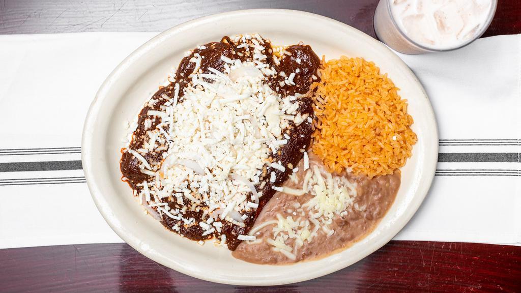 23. Enchiladas · Sautéed corn tortillas covered with your choice of red or green sauce, cheese and fresh onions.