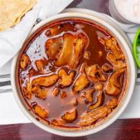 36. Menudo · Soup made with tripe, onions, tomatoes, chilies, oregano, and other seasoning, served with h...
