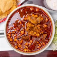 Pozole · Soup made with pork, seasoned hominy, and garnished with chili peppers, onions, garlic. radi...